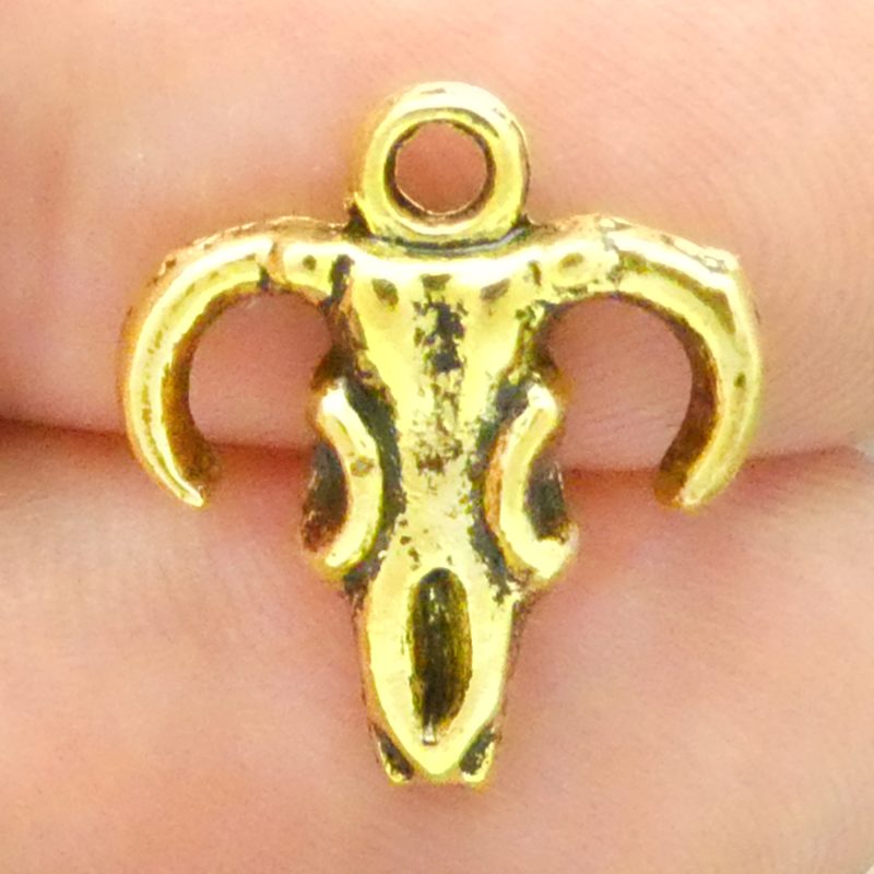 gold cow skull charm