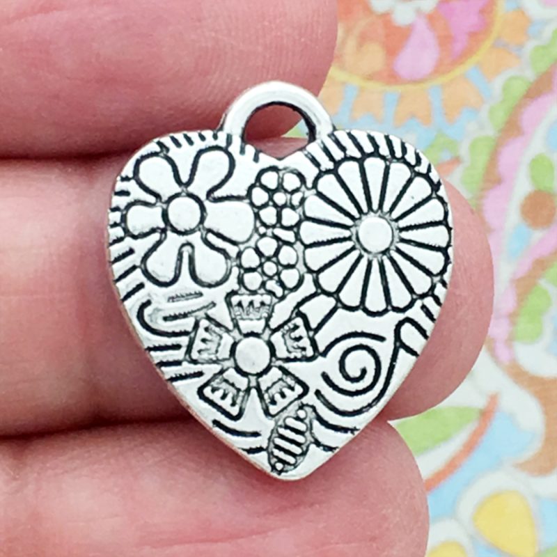 silver flower heart charm