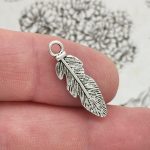 small feather charm