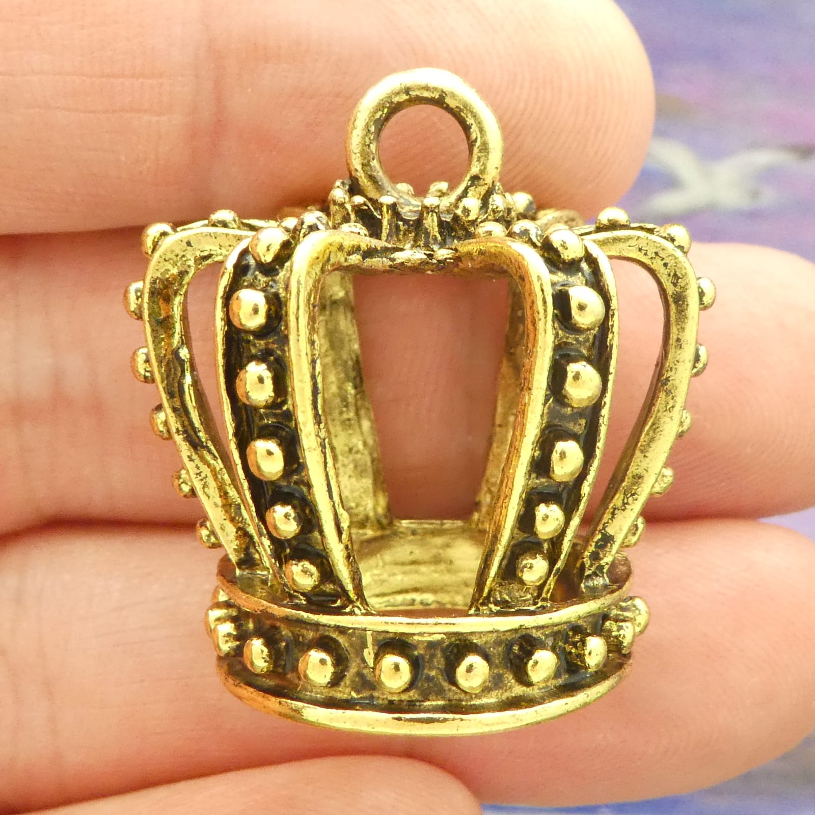 crown pendants for jewelry making in gold pewter closeup