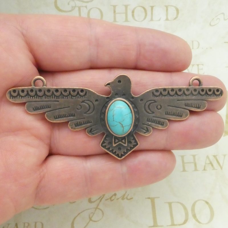 copper turquoise thunderbird pendant in pewter closeup