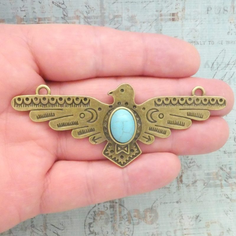 bronze turquoise thunderbird pendant in pewter closeup