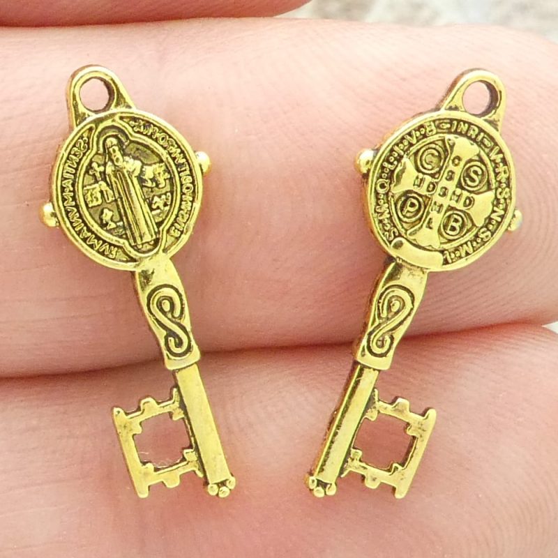 small St Benedict key medals in gold pewter closeup