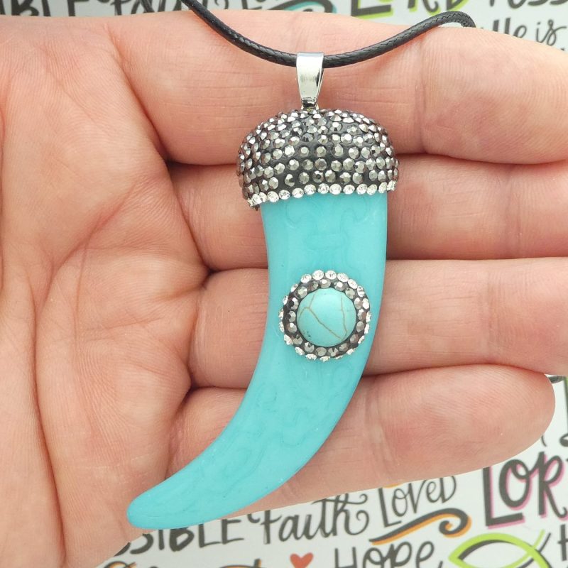 turquoise tiger claw pendants closeup