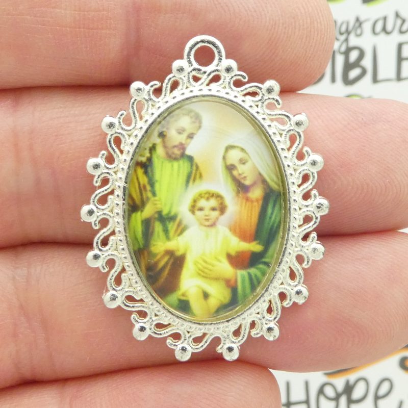 Holy Family pendants in silver closeup