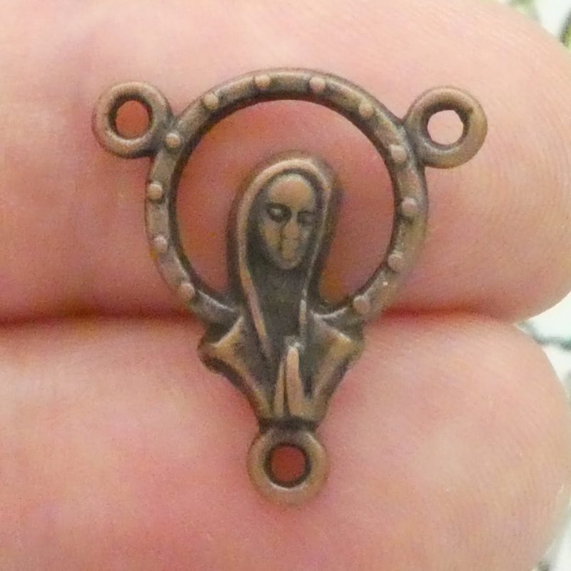 Virgin Mary rosary centerpiece bulk in copper closeup