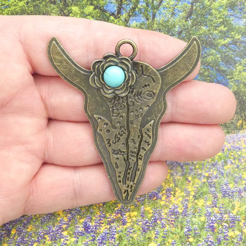 bronze cow skull pendant with turquoise