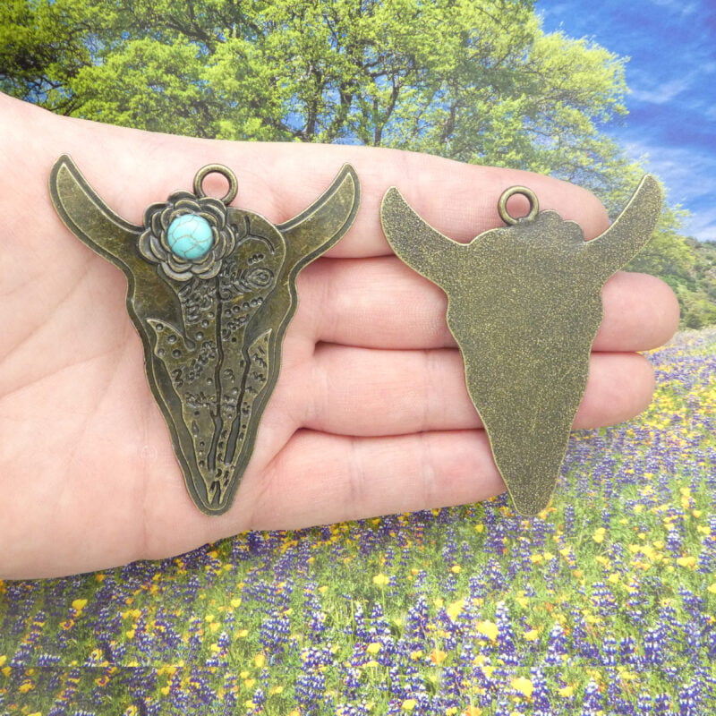 bronze cow skull pendant with turquoise front and back
