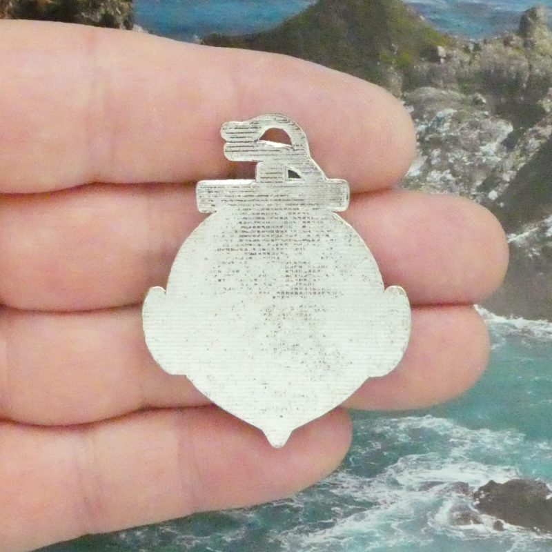 Close-up of the back of the silver anchor charm