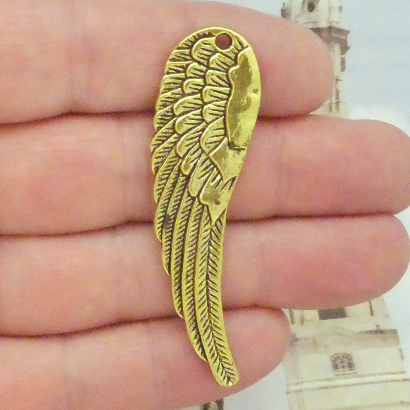 gold angel wing pendant