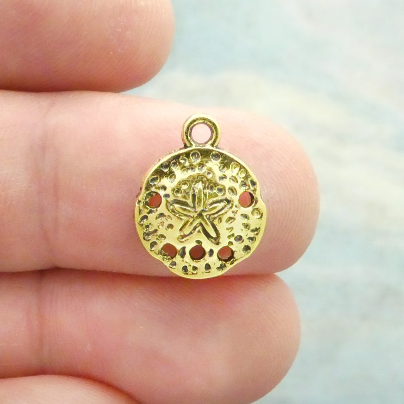 gold sand dollar charm