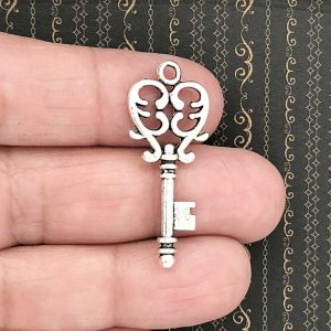 silver key charm